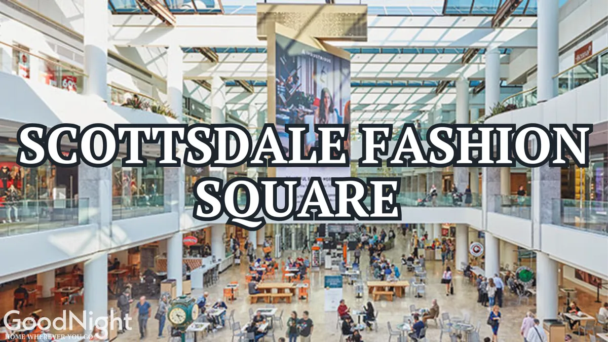 The energetic interior of Scottsdale Fashion Square, showcasing a bustling central atrium with large digital screens, fashionable retail shops, and stylish seating areas. Shoppers and diners are seen enjoying the lively atmosphere, underscoring the area's appeal as a premier shopping and social destination.